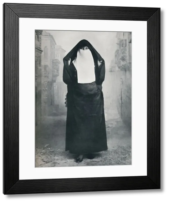Framed Print : A Turkish lady in outdoor costume, 1912. Artist: Lekegian & Co Framed Print : A Turkish lady in outdoor costume, 1912. Artist: Lekegian & Co