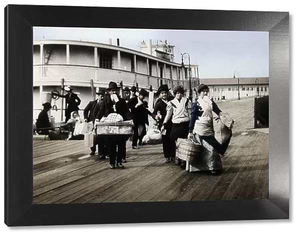 Immigrants to the USA landing at Ellis Island, New York, c1900