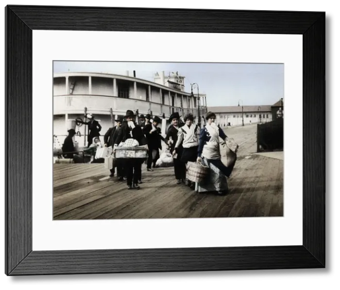 Framed Print : Immigrants to the USA landing at Ellis Island, New York, c1900 Framed Print : Immigrants to the USA landing at Ellis Island, New York, c1900