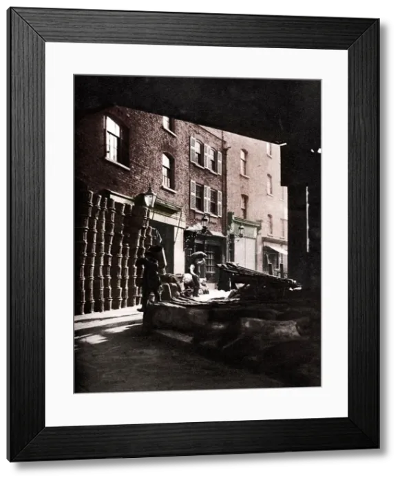 Framed Print : Fruit baskets piled against houses at Borough Market, London, 1926-1927. Artist: Whiffin Framed Print : Fruit baskets piled against houses at Borough Market, London, 1926-1927. Artist: Whiffin