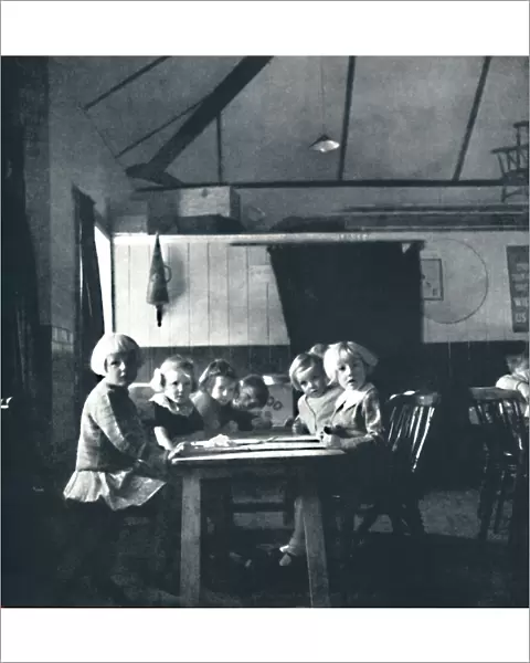 Lessons for London children in the village hall, 1941. Artist: Cecil Beaton