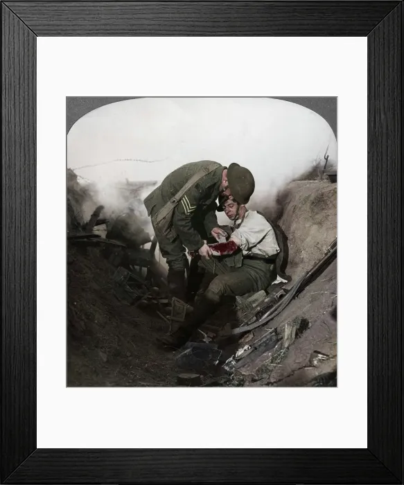 Framed Print : Soldier receiving first aid from a sergeant in a sap, Battle of Peronne, World War I, 1914-1918. Artist: Realistic Travels Publishers Framed Print : Soldier receiving first aid from a sergeant in a sap, Battle of Peronne, World War I, 1914-1918. Artist: Realistic Travels Publishers
