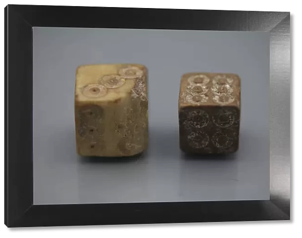 A pair of Roman dice made from carved bone, 1st century BC