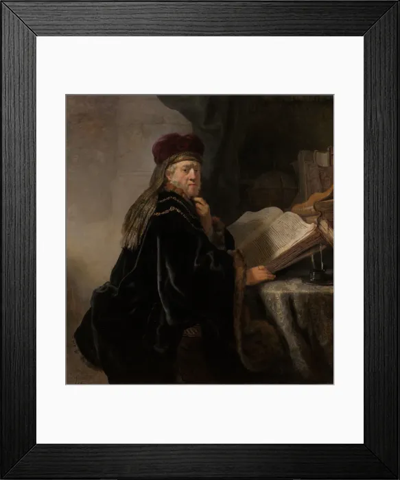 Framed Print : A Scholar Seated at a Desk (Scholar at his Study). Artist: Rembrandt van Rhijn (1606-1669) Framed Print : A Scholar Seated at a Desk (Scholar at his Study). Artist: Rembrandt van Rhijn (1606-1669)