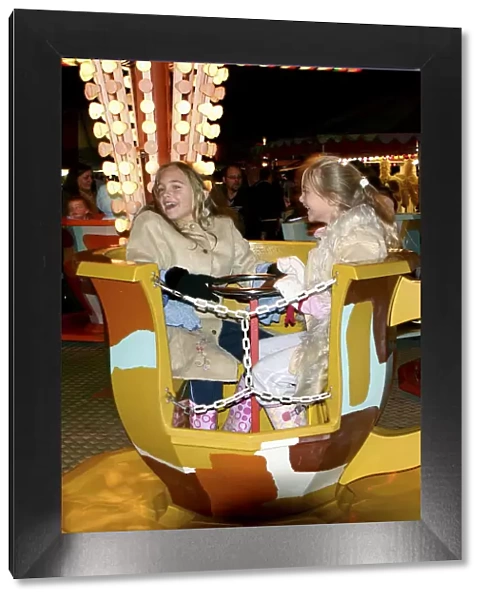 Children on a fairground ride, 2005