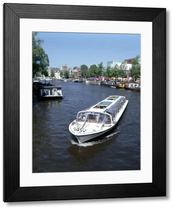 Framed Print : Amstel Canal and Bloumerbrug, Binnen, Amsterdam, Netherlands Framed Print : Amstel Canal and Bloumerbrug, Binnen, Amsterdam, Netherlands