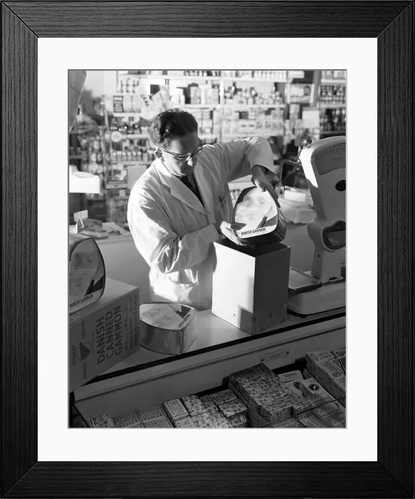 Framed Print : Shopkeeper unpacking canned gammon joints, Mexborough, South Yorkshire, 1963. Artist Framed Print : Shopkeeper unpacking canned gammon joints, Mexborough, South Yorkshire, 1963. Artist