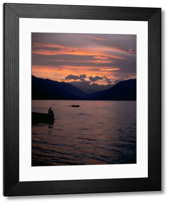 Framed Print : Fishing at sunset, Lake Maggiore, Italy Framed Print : Fishing at sunset, Lake Maggiore, Italy