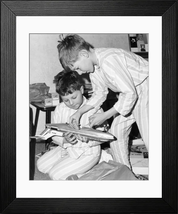 Framed Print : Boys playing with a model plane, c1960s Framed Print : Boys playing with a model plane, c1960s