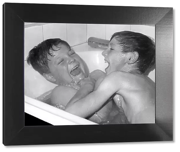 Two boys playing in the bath, Horley, Surrey, c1960-1979(?)