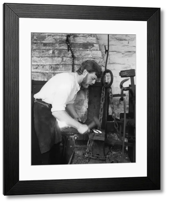 Framed Print : Black Country Museum, Birmingham, West Midlands, 1986. A blacksmith at work in a smithy Framed Print : Black Country Museum, Birmingham, West Midlands, 1986. A blacksmith at work in a smithy