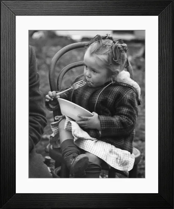 Framed Print : Gypsy girl eating, 1960s Framed Print : Gypsy girl eating, 1960s