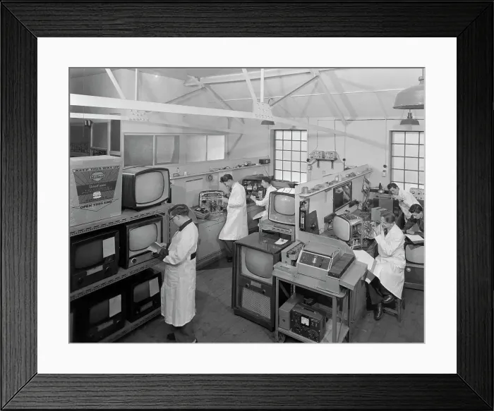 Framed Print : Technicians at work in Clays TV repair in shop, Mexborough, South Yorkshire, February 1959 Framed Print : Technicians at work in Clays TV repair in shop, Mexborough, South Yorkshire, February 1959
