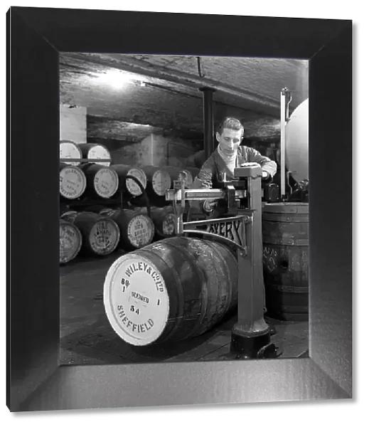 Weighing barrels of blended whisky at Wiley & Co, Sheffield, South Yorkshire, 1960