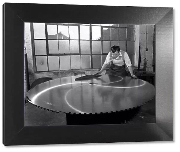 Quality checking a giant saw blade, Edgar Allens steel foundry, Sheffield, South Yorkshire, 1963