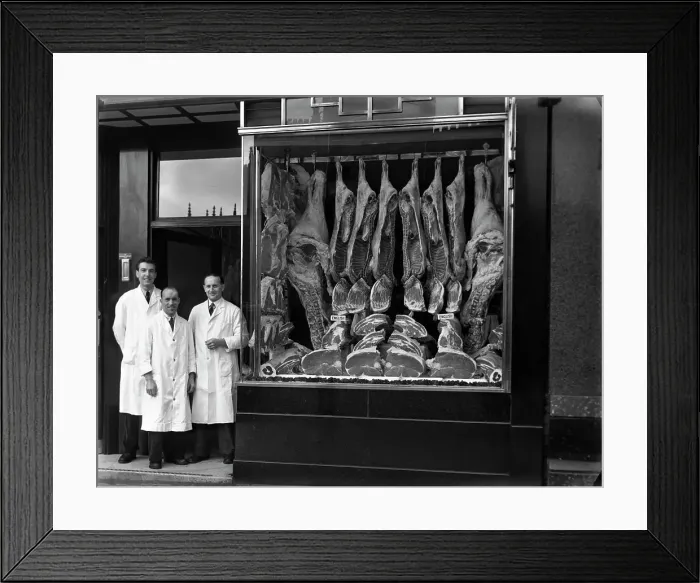 Framed Print : Butchers standing next to their shop window display, South Yorkshire, 1955. Artist Framed Print : Butchers standing next to their shop window display, South Yorkshire, 1955. Artist