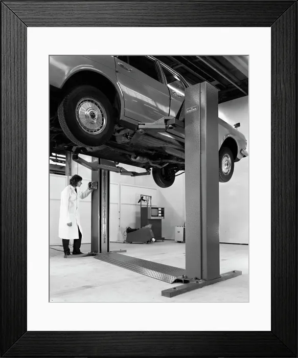 Framed Print : A Ford Zodiac on a Laycock asymmetric lift, 1972. Artist: Michael Walters Framed Print : A Ford Zodiac on a Laycock asymmetric lift, 1972. Artist: Michael Walters