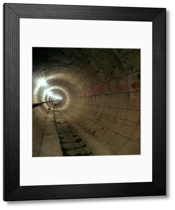 Framed Print : Empty Jubilee Line Tube tunnel, before completion, London, 1974. Artist: Michael Walters Framed Print : Empty Jubilee Line Tube tunnel, before completion, London, 1974. Artist: Michael Walters
