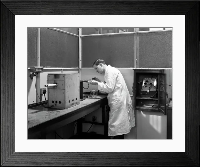 Framed Print : Lab tachnician using a table top test furnace, Sheffield, South Yorkshire, 1962. Artist Framed Print : Lab tachnician using a table top test furnace, Sheffield, South Yorkshire, 1962. Artist