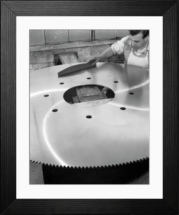Framed Print : A machinist quality checking a six foot circular saw blade, Sheffield, South Yorkshire, 1963 Framed Print : A machinist quality checking a six foot circular saw blade, Sheffield, South Yorkshire, 1963