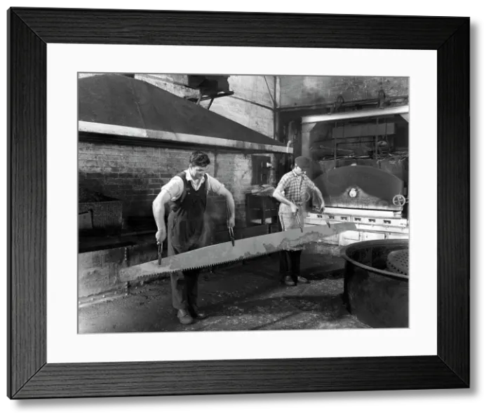 Framed Print : Heat treating a two metre saw blade, Slack Sellars & Co Ltd, Sheffield, South Yorkshire, 1963 Framed Print : Heat treating a two metre saw blade, Slack Sellars & Co Ltd, Sheffield, South Yorkshire, 1963