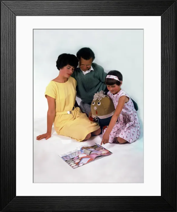 Framed Print : Family group looking at a magazine, 1963. Artist: Michael Walters Framed Print : Family group looking at a magazine, 1963. Artist: Michael Walters