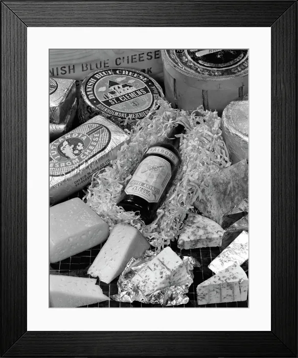Framed Print : A selection of Danish cheeses and a bottle of Aalborg aquavit, 1963 Framed Print : A selection of Danish cheeses and a bottle of Aalborg aquavit, 1963