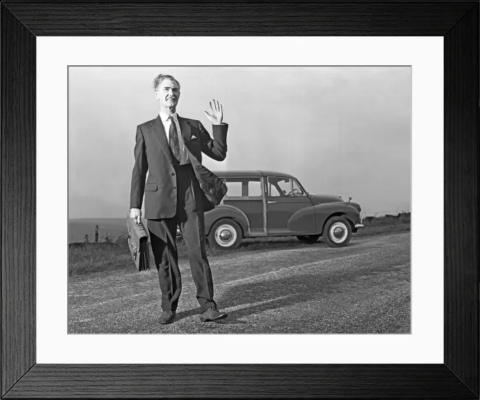 Framed Print : Waving Sales rep with a Moris Minor Shooting Brake, 3rd Aug 1963. Artist: Michael Walters Framed Print : Waving Sales rep with a Moris Minor Shooting Brake, 3rd Aug 1963. Artist: Michael Walters