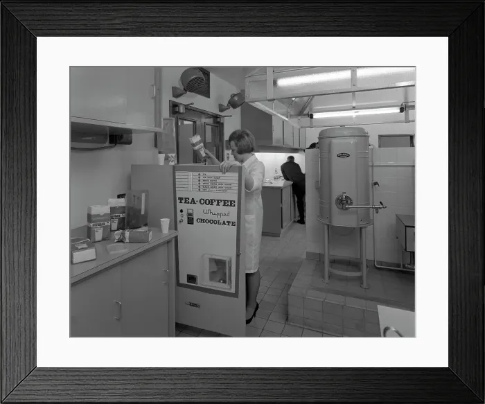 Framed Print : Loading a drinks vending machine at an experimental kitchen in Sheffield, South Yorkshire, 1966 Framed Print : Loading a drinks vending machine at an experimental kitchen in Sheffield, South Yorkshire, 1966