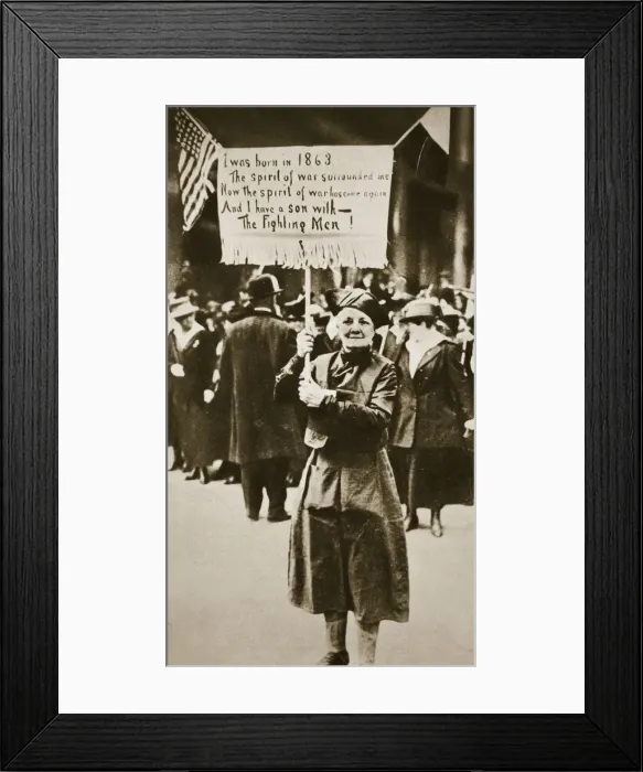 Framed Print : Woman holding a placard in support of the war effort, USA, World War I, c1914-c1918 Framed Print : Woman holding a placard in support of the war effort, USA, World War I, c1914-c1918