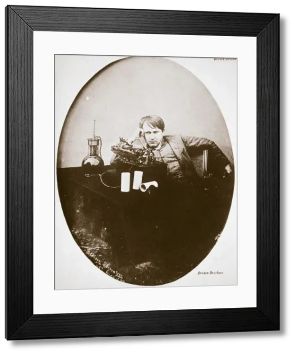 Framed Print : Thomas Alva Edison, American inventor, sitting beside his improved machine, 1889 Framed Print : Thomas Alva Edison, American inventor, sitting beside his improved machine, 1889