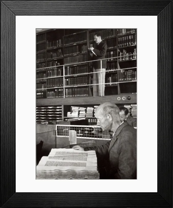 Framed Print : A labourer reads a book in a library, Germany, 1936 Framed Print : A labourer reads a book in a library, Germany, 1936