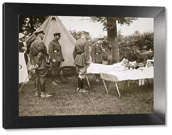 King George V conversing with wounded officers, France, World War I, 1916. Artist