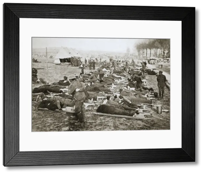 Framed Print : Wounded men waiting to be taken away to a clearing station, France, World War I, 1916 Framed Print : Wounded men waiting to be taken away to a clearing station, France, World War I, 1916