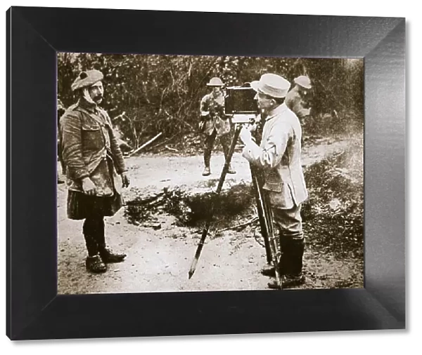 Cameraman filming a wounded soldier, Somme campaign, France, World War I, 1916. Artist