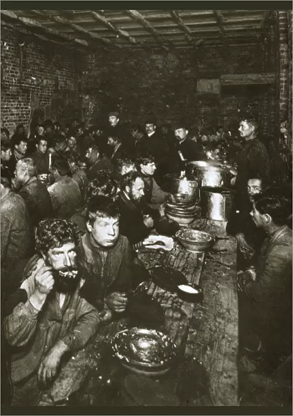 Russian manual labourers eating a meal, late 19th century