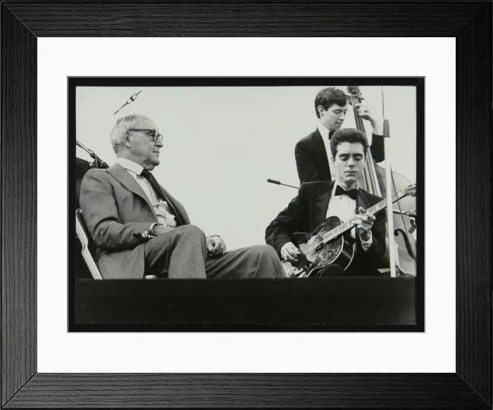 Framed Print : Benny Goodman watching Phil Flanigan and Chris Flory, Knebworth, Hertfordshire, 1982 Framed Print : Benny Goodman watching Phil Flanigan and Chris Flory, Knebworth, Hertfordshire, 1982