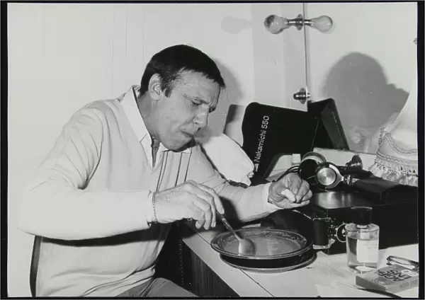 Buddy Rich eating backstage at Ronnie Scotts Jazz Club, London, 1979