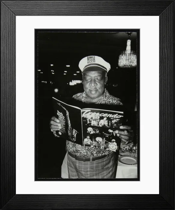 Framed Print : Count Basie reading a copy of Crescendo magazine at the Grosvenor House Hotel, London, 1979 Framed Print : Count Basie reading a copy of Crescendo magazine at the Grosvenor House Hotel, London, 1979