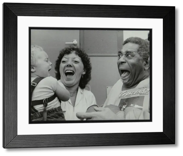 Framed Print : Dizzy Gillespie meeting baby Gary Colfer at Knebworth, Hertfordshire, July 1982. Artist Framed Print : Dizzy Gillespie meeting baby Gary Colfer at Knebworth, Hertfordshire, July 1982. Artist