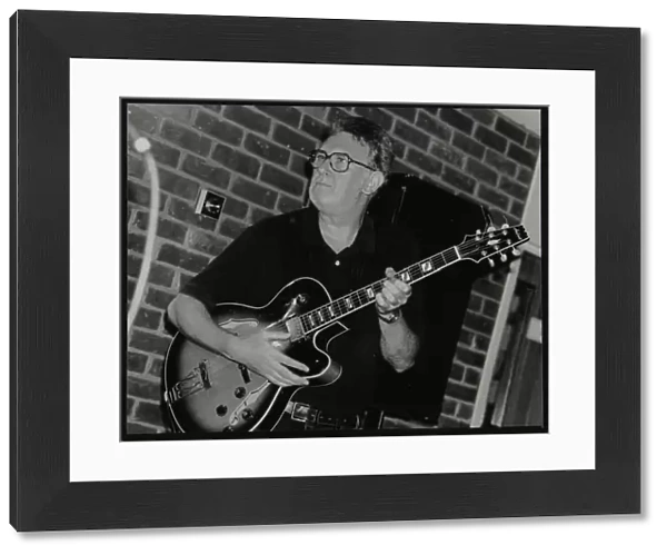 Jim Mullen playing guitar at The Fairway, Welwyn Garden City, Hertfordshire, 3 August 1997
