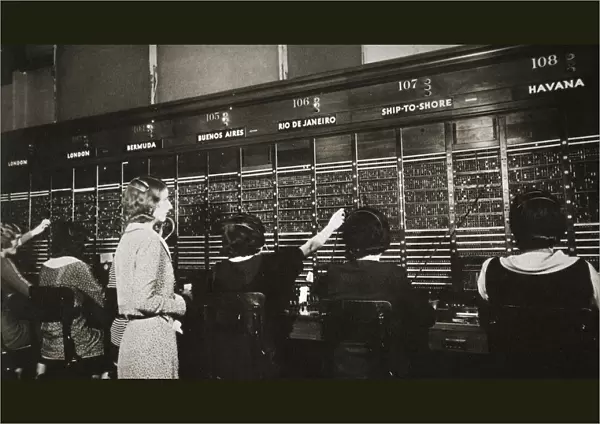 Female workers in the telephone room, New York Stock Exchange, USA, early 1930s. Artist