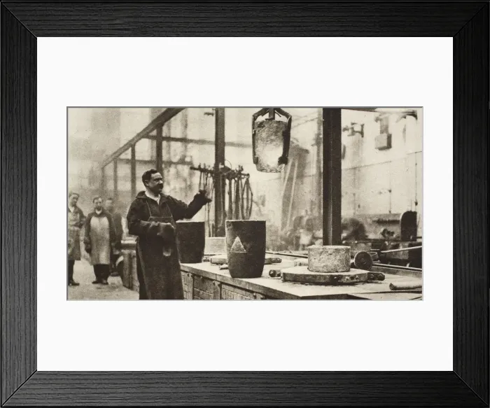 Framed Print : Making money; pots of liquid metal being handled in the melting room, 20th century Framed Print : Making money; pots of liquid metal being handled in the melting room, 20th century