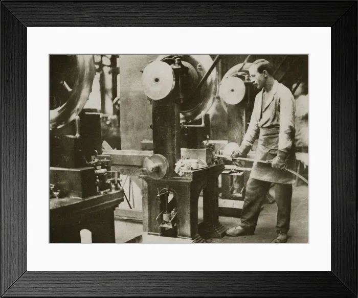 Framed Print : Money making; cutting strips of silver into disks, 20th century Framed Print : Money making; cutting strips of silver into disks, 20th century