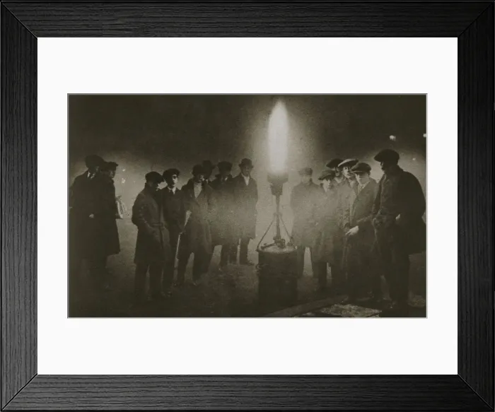 Framed Print : Gathering around an acetylene flare at a traffic control point in the fog, early 20th century Framed Print : Gathering around an acetylene flare at a traffic control point in the fog, early 20th century