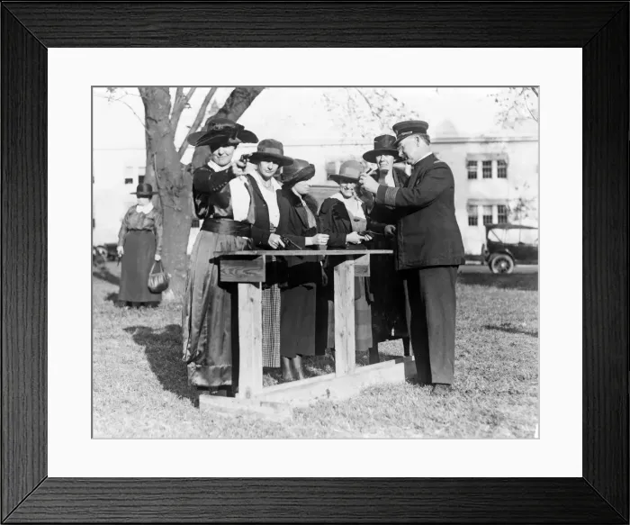 Framed Print : Police officer teaching women how to shoot, c. 1920 Framed Print : Police officer teaching women how to shoot, c. 1920