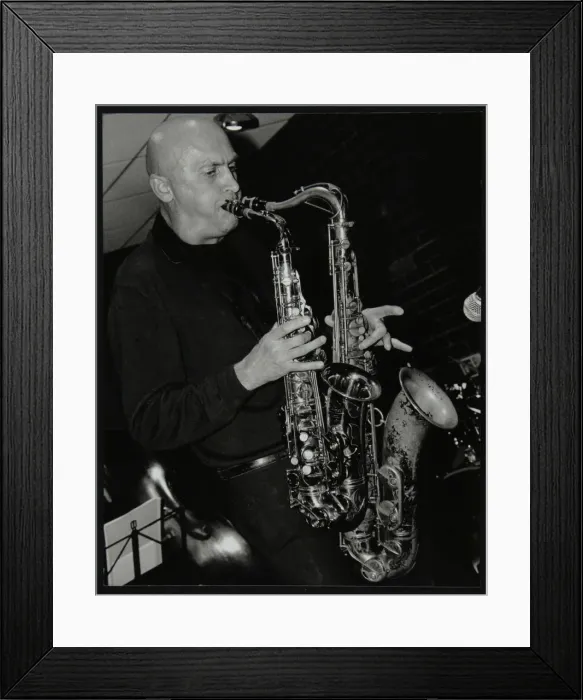 Framed Print : Kelvin Christiane playing two saxophones at The Fairway, Welwyn Garden City, Hertfordshire, 2002 Framed Print : Kelvin Christiane playing two saxophones at The Fairway, Welwyn Garden City, Hertfordshire, 2002