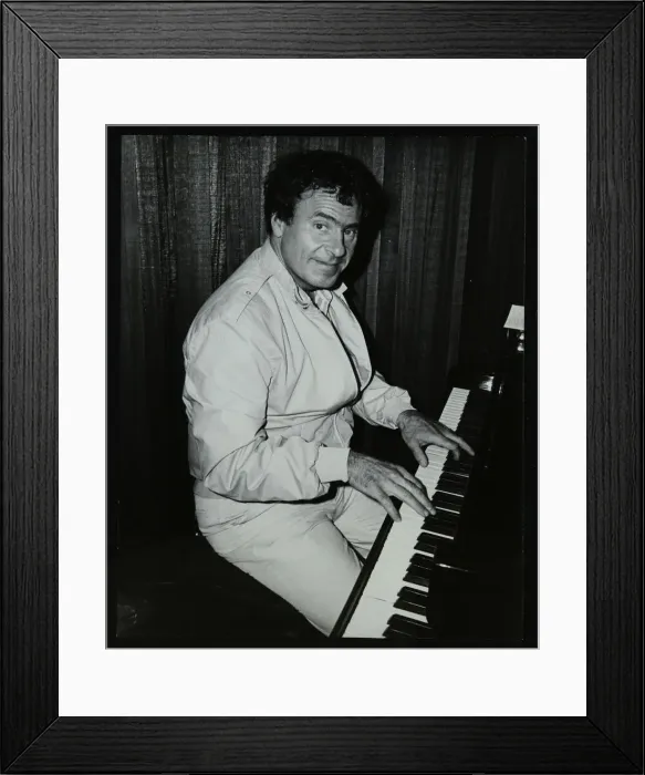 Framed Print : American trombonist and teacher Phil Wilson playing the piano, London, 1985. Artist Framed Print : American trombonist and teacher Phil Wilson playing the piano, London, 1985. Artist