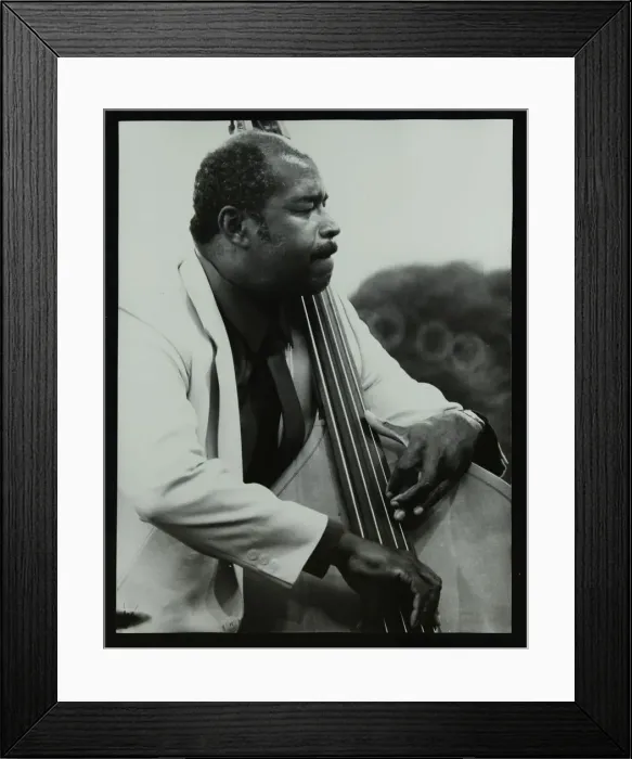 Framed Print : Bassist Eddie Jones playing at the Capital Radio Jazz Festival, Knebworth, Hertfordshire, 1982 Framed Print : Bassist Eddie Jones playing at the Capital Radio Jazz Festival, Knebworth, Hertfordshire, 1982