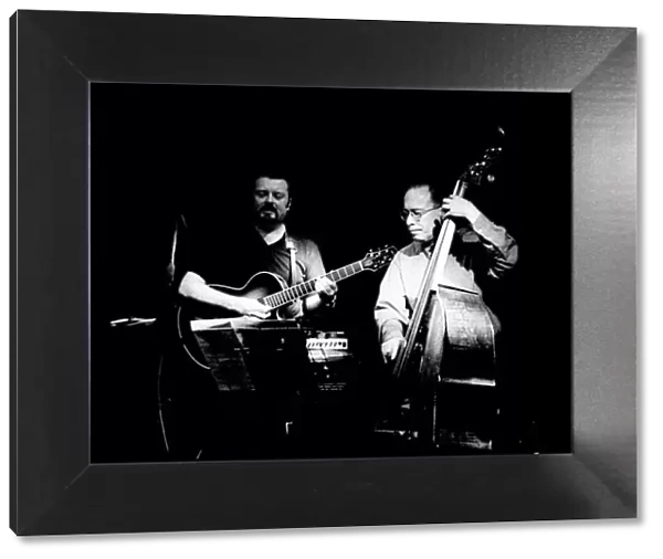 Eddie Gomez and Martin Taylor, Ronnie Scotts, London, July 2000. Artist: Brian O Connor
